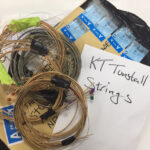 KT Tunstall – guitar string coil on wraparound leather bracelet